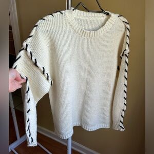 White and black sweater